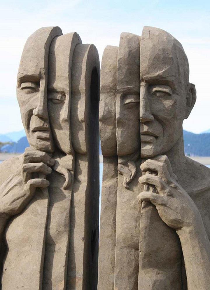 Carl Jara - faces sand sculpture